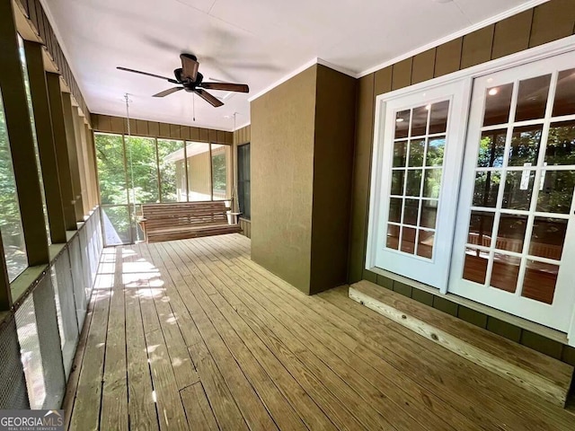 exterior space featuring a ceiling fan