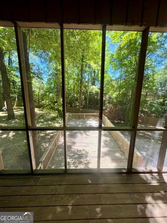 unfurnished sunroom featuring a healthy amount of sunlight