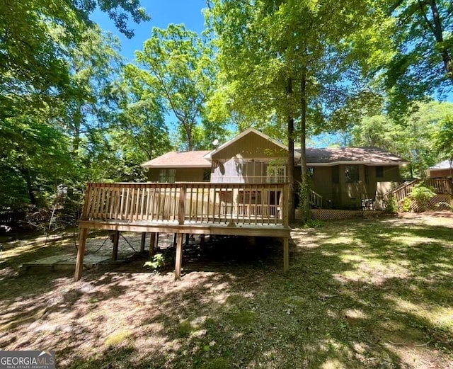 rear view of property with a deck