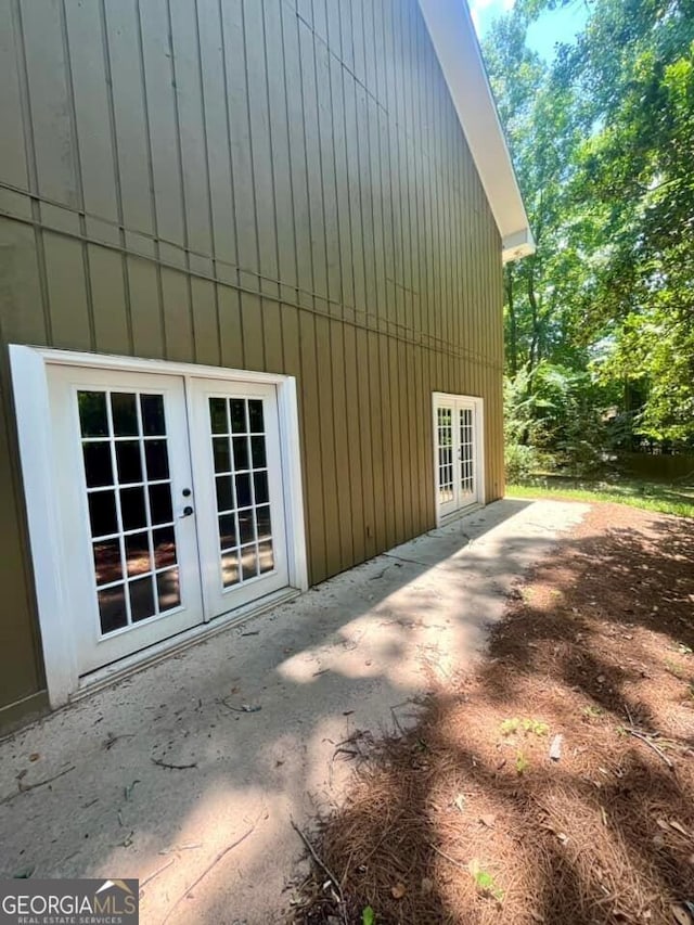 view of side of home with a patio and french doors