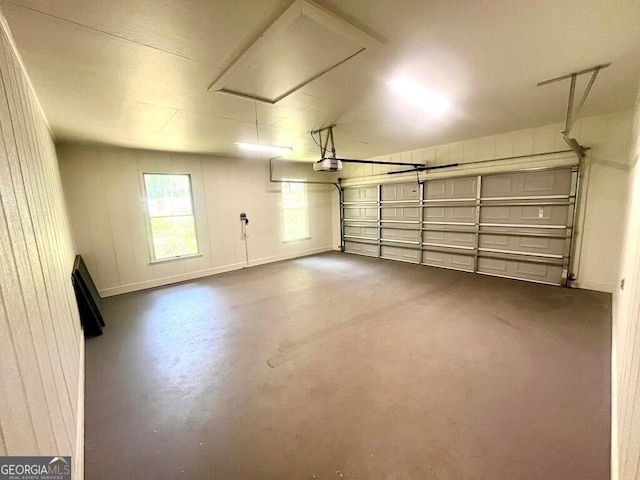garage featuring baseboards and a garage door opener