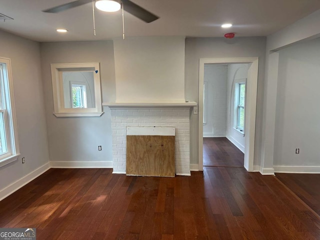 unfurnished living room featuring hardwood / wood-style floors, baseboards, recessed lighting, a fireplace, and ceiling fan