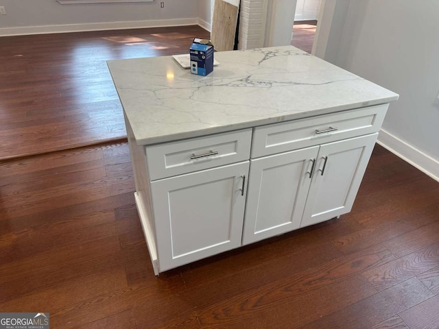 room details with baseboards and wood finished floors