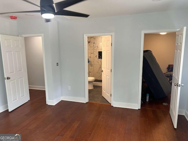 unfurnished bedroom with ensuite bath, wood finished floors, and baseboards