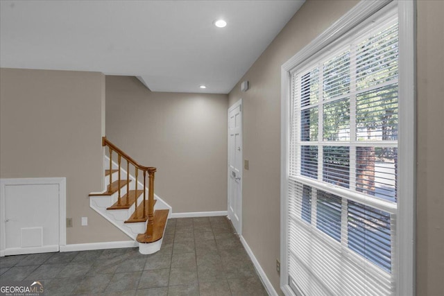 tiled entryway featuring stairway, recessed lighting, and baseboards