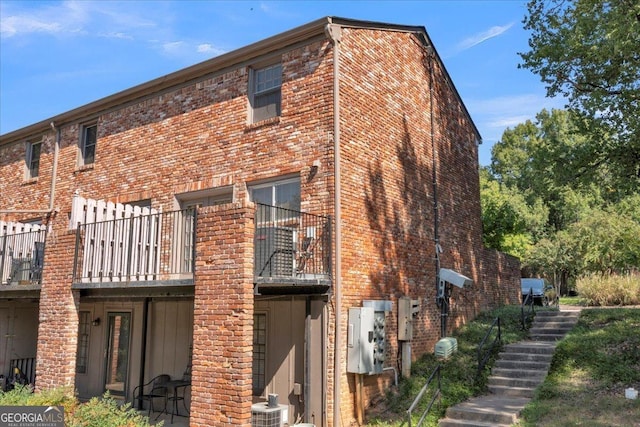 back of house with brick siding