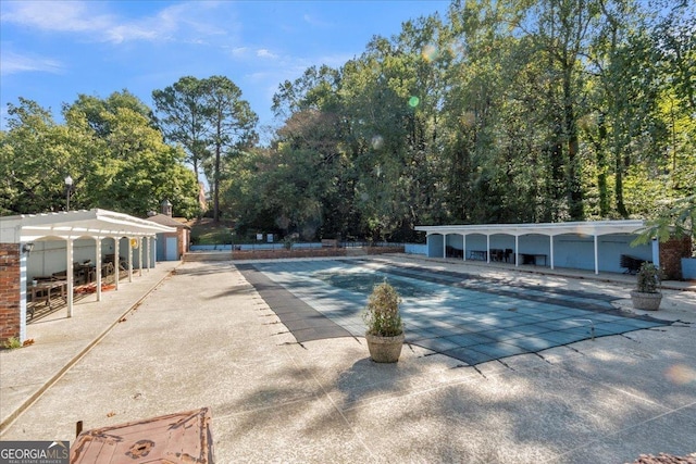 view of pool featuring a patio area and a pergola