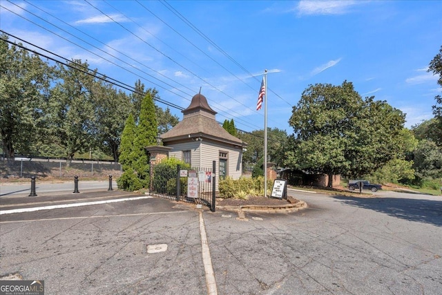 exterior space featuring a gate and fence