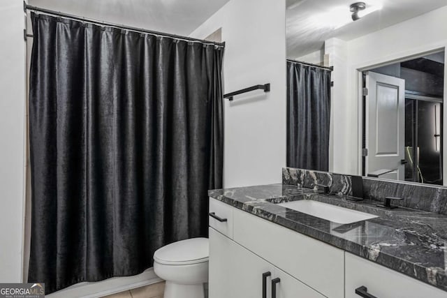 3324 Peachtree Rd NE Unit 1115, Atlanta, GA 30326 - full bath with vanity, toilet, and tile patterned flooring