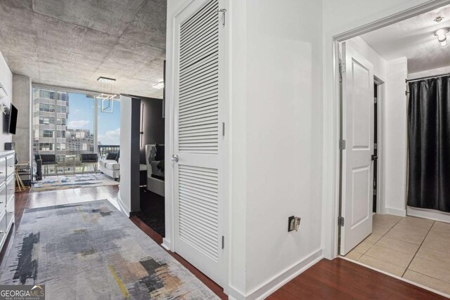 3324 Peachtree Rd NE Unit 1115, Atlanta, GA 30326 - corridor with expansive windows, baseboards, and wood finished floors
