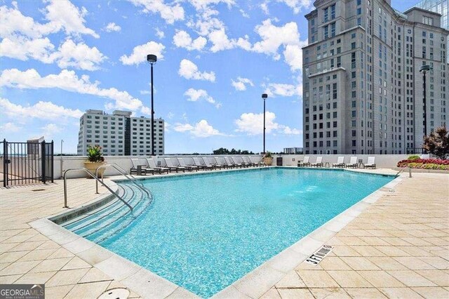 3324 Peachtree Rd NE Unit 1115, Atlanta, GA 30326 - community pool featuring a patio