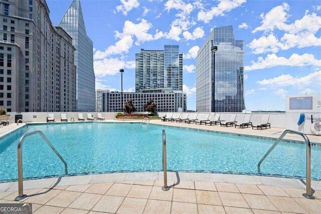 3324 Peachtree Rd NE Unit 1115, Atlanta, GA 30326 - pool featuring a city view and a patio area