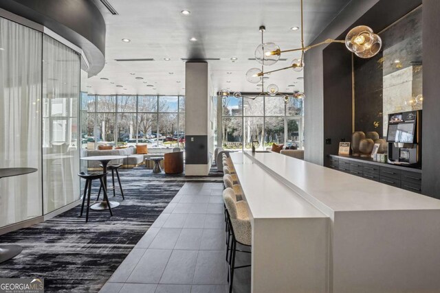 3324 Peachtree Rd NE Unit 1115, Atlanta, GA 30326 - interior space with dark tile patterned flooring, a high ceiling, recessed lighting, and expansive windows