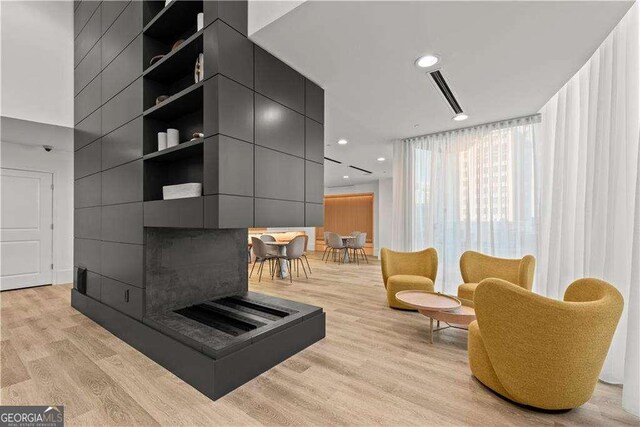 3324 Peachtree Rd NE Unit 1115, Atlanta, GA 30326 - living area featuring recessed lighting, light wood-style flooring, and a towering ceiling