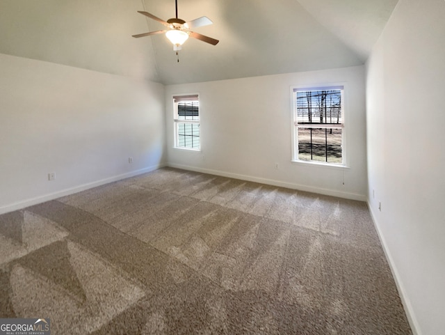 empty room featuring high vaulted ceiling, carpet, baseboards, and ceiling fan