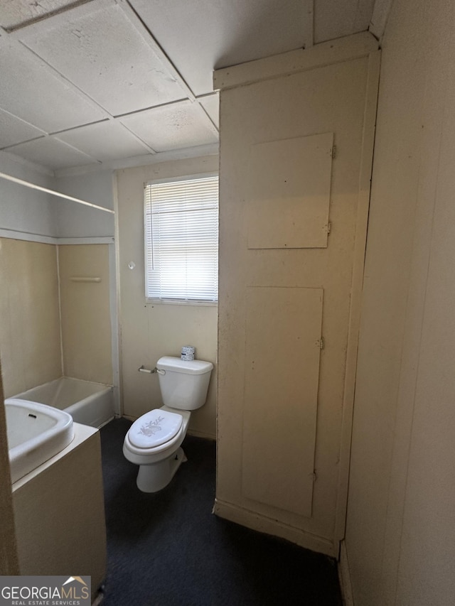 bathroom featuring toilet, bathtub / shower combination, and vanity