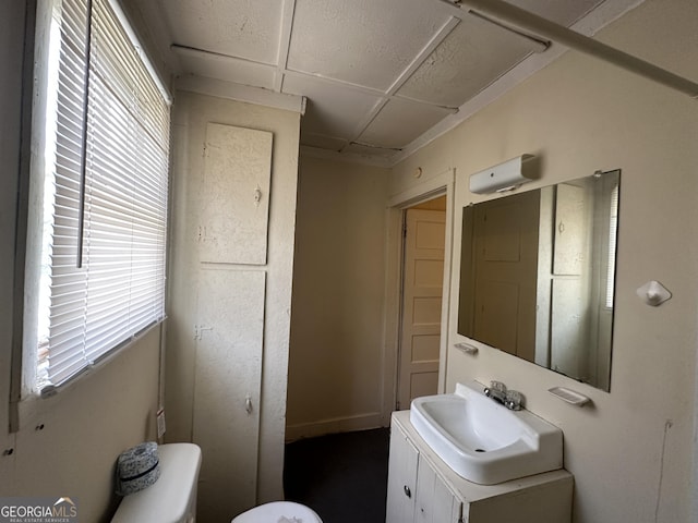 bathroom featuring vanity and toilet