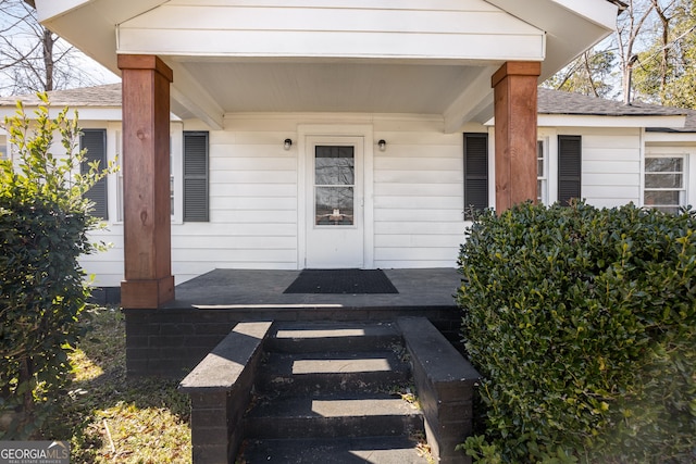 property entrance with covered porch