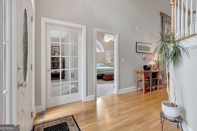 2510 Shoreline Pkwy, Villa Rica, GA 30180 - entryway featuring wood finished floors, baseboards, and a ceiling fan