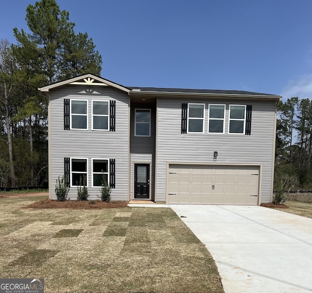 view of front of property featuring an attached garage and driveway