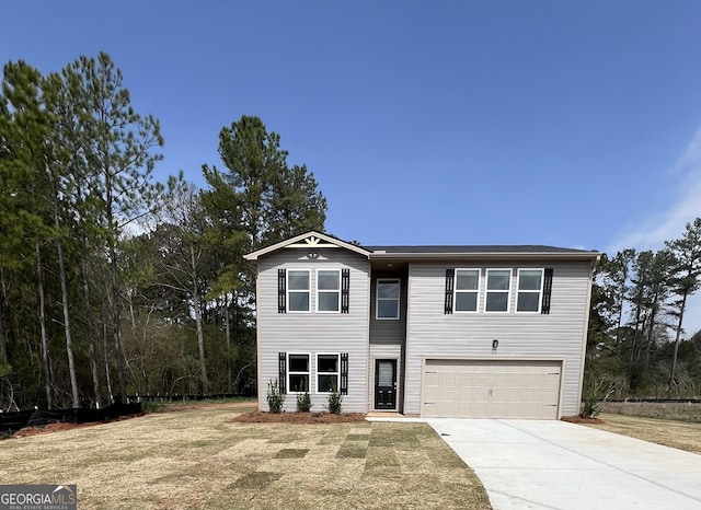 view of front of house with concrete driveway and an attached garage