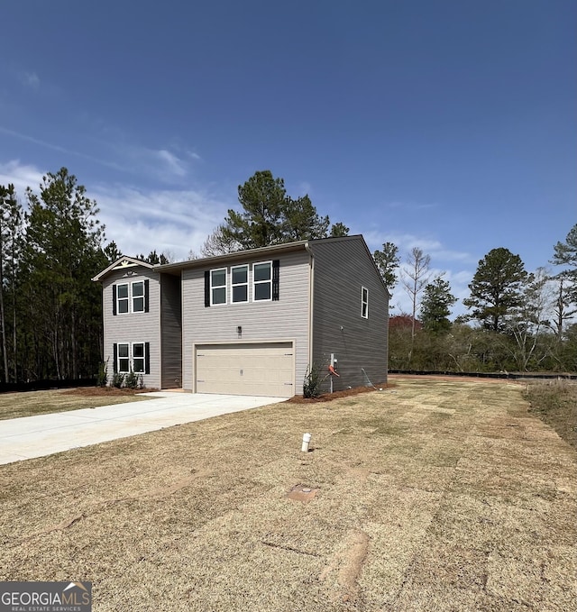 view of front facade featuring concrete driveway and a garage