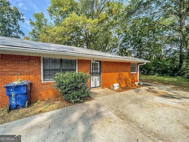 view of front of property featuring brick siding