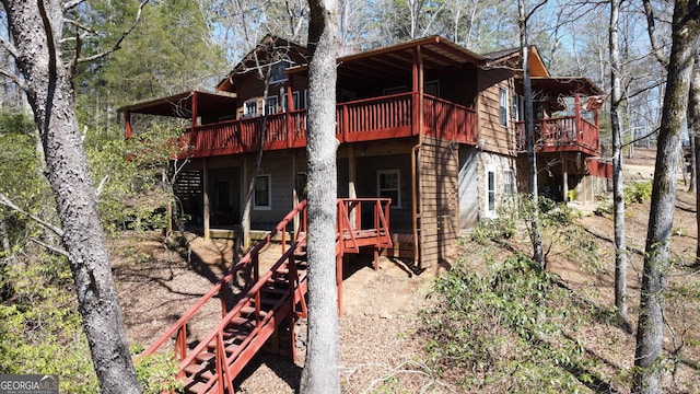 view of property exterior with a deck