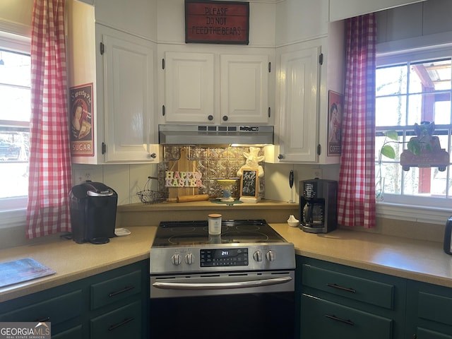 kitchen with white cabinetry, light countertops, stainless steel range with electric stovetop, and under cabinet range hood