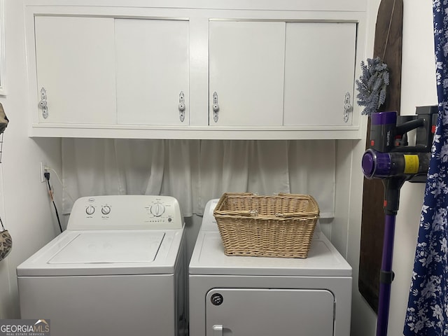 laundry area with cabinet space and washing machine and dryer