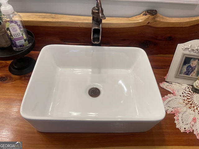 interior details with a freestanding tub and a sink