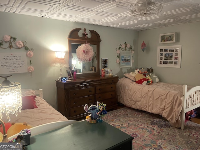 bedroom with a notable chandelier and an ornate ceiling