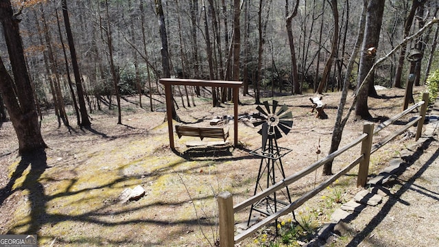 view of yard featuring a wooded view