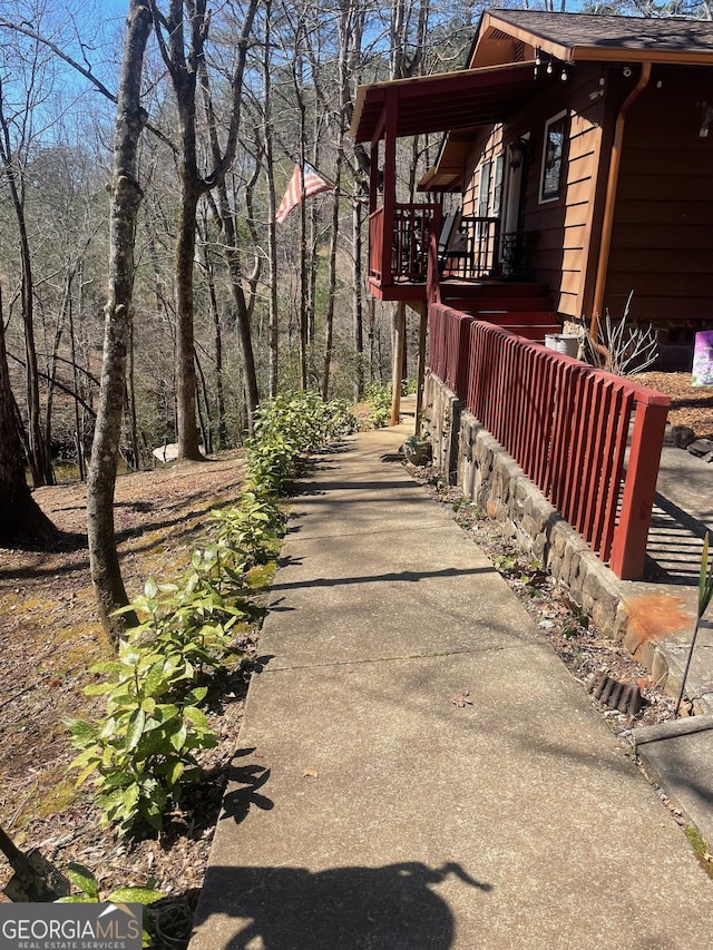 view of side of home featuring a shingled roof