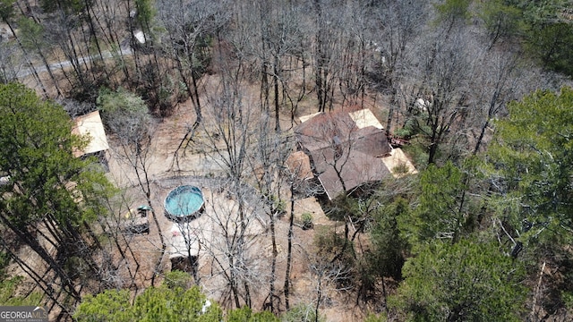 drone / aerial view featuring a view of trees