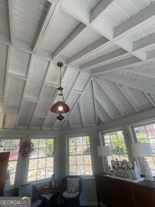 room details with beamed ceiling and wood walls