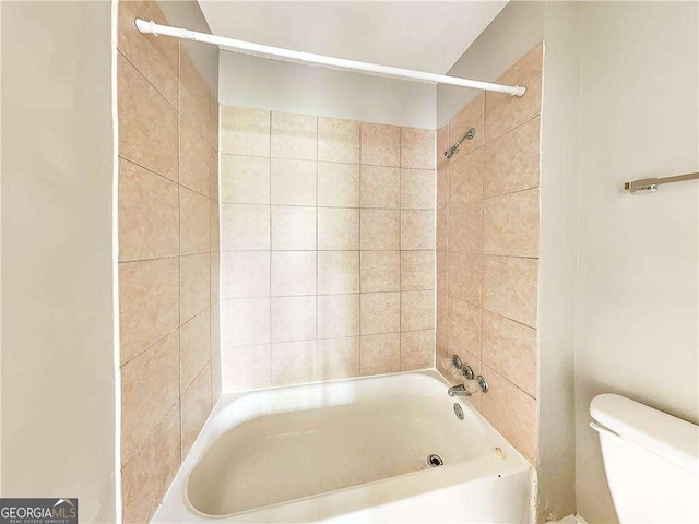 full bathroom with toilet and bathing tub / shower combination