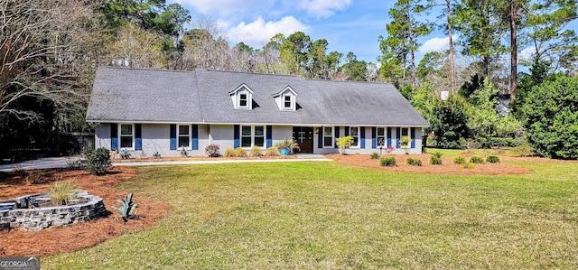 cape cod-style house with a front lawn