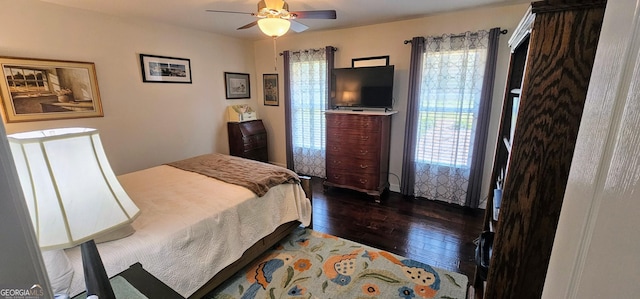 bedroom featuring ceiling fan and dark wood finished floors