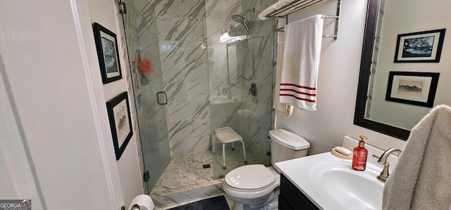 bathroom with a marble finish shower, toilet, and vanity