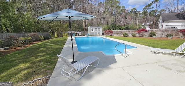 view of swimming pool featuring an outdoor structure, a lawn, a fenced backyard, and a shed