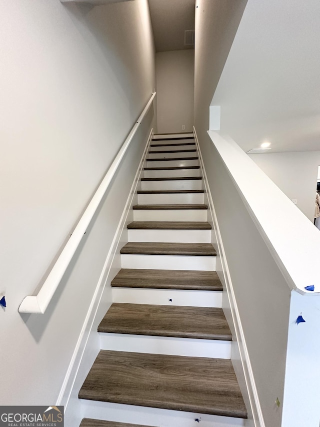 staircase featuring visible vents