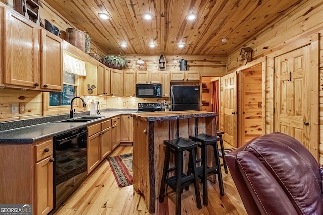 kitchen featuring wine cooler, wooden ceiling, light wood-style floors, black appliances, and a sink