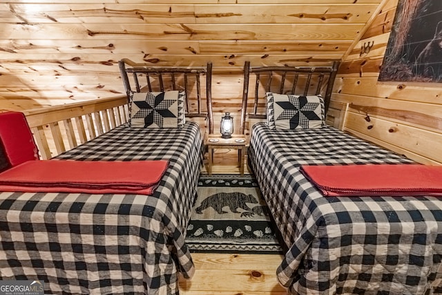 bedroom with wooden walls