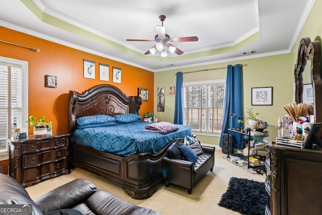 9620 Coastal Pointe Dr, Villa Rica, GA 30180 - carpeted bedroom with visible vents, a ceiling fan, crown molding, and a tray ceiling