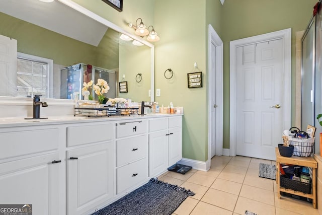 9620 Coastal Pointe Dr, Villa Rica, GA 30180 - full bathroom featuring tile patterned floors, a stall shower, double vanity, and a sink