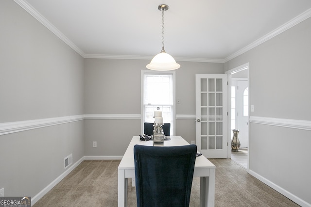 dining area featuring ornamental molding, light colored carpet, visible vents, and baseboards