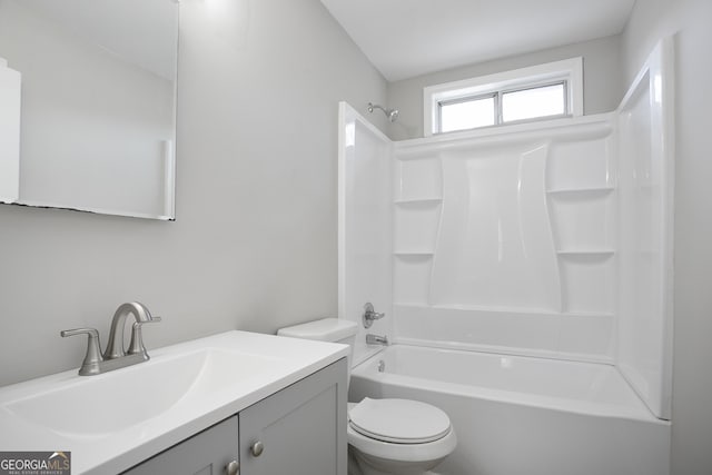 full bathroom featuring toilet, vanity, and  shower combination