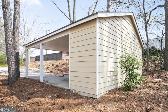 view of outdoor structure with an outbuilding and an attached carport