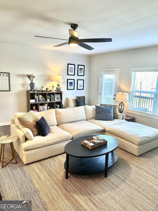 living area featuring ceiling fan